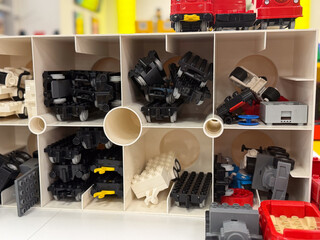 Naklejka premium Lego parts in small cubby storage