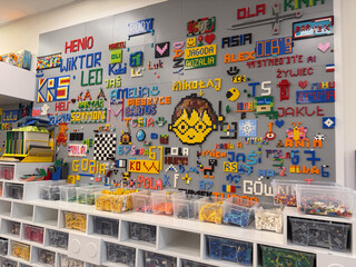 Naklejka premium Colorful lego mosaic wall with sorted bins