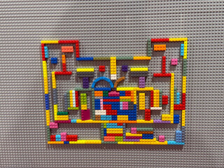 Naklejka premium Colorful lego maze with apple silhouette