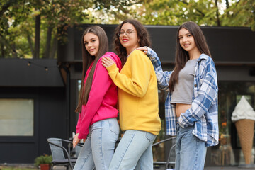 Happy teenage girls in park