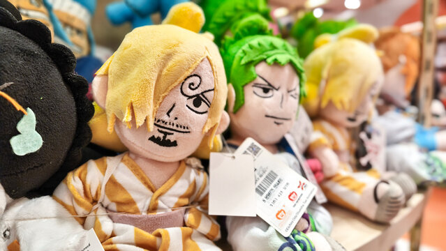 One Piece anime character plush toys Sanji and Zoro in Wano arc outfits displayed on a retail shelf on January 4, 2026 in Bangkok, Thailand.