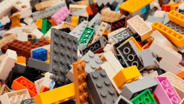 Close up view of various colorful LEGO plastic building bricks and toy blocks in many different shapes and sizes on September 15, 2025 in Bangkok, Thailand.