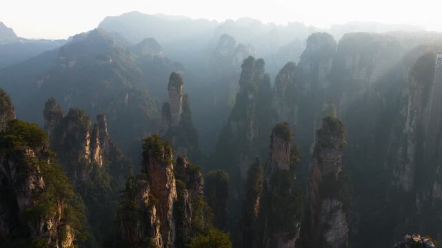 Aerial View Of Towering Sandstone Pillars Within The Zhangjiajie National Forest Park At Sunrise In Hunan Province, China.