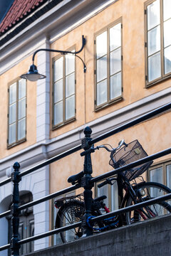 Bicycle line for cycling on street shows urban mobility transport near lamps and architecture in Stockholm Sweden in bright daylight