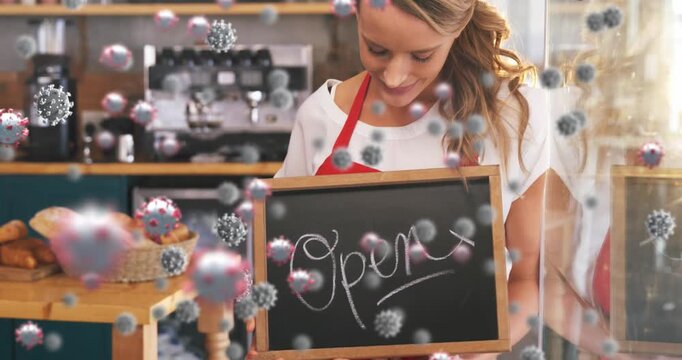 Animation of virus cells over happy caucasian waitress with open sign
