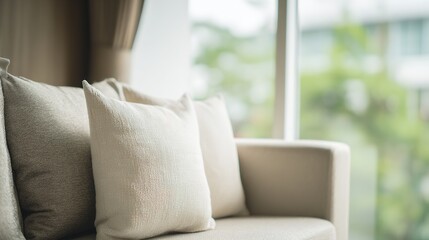 Fototapeta premium A contemporary sofa in neutral tones, showcasing elegant and cozy living space aesthetics.