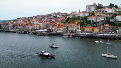 An aerial panorama view of the old town of the city Porto in Portugal beside Douro river on a sunny summer day.