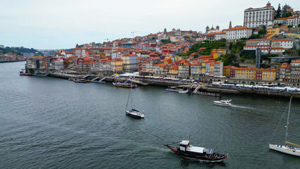 Fototapeta premium An aerial panorama view of the old town of the city Porto in Portugal beside Douro river on a sunny summer day.