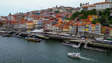 An aerial panorama view of the old town of the city Porto in Portugal beside Douro river on a sunny summer day.