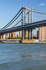 Obraz premium View from the East River of the Manhattan Bridge in New York City. Vertically.