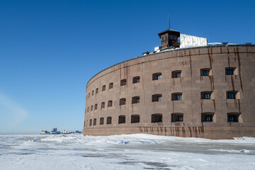 At the ancient fort "Emperor Alexander I" (Plague Fort) on a sunny February day. Gulf of Finland. Kronstadt, Russia