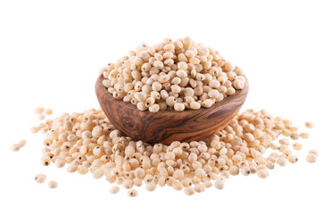 Sorghum seeds isolated on white background. Sorghum bicolor or sorgo grains in wooden bowl. Clipping path.