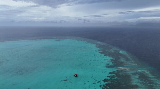 Drone Aerial View of Onok Island, Balabac, Philippines. Tropical Beach, Clear Water, Coral Reefs and Turtles.