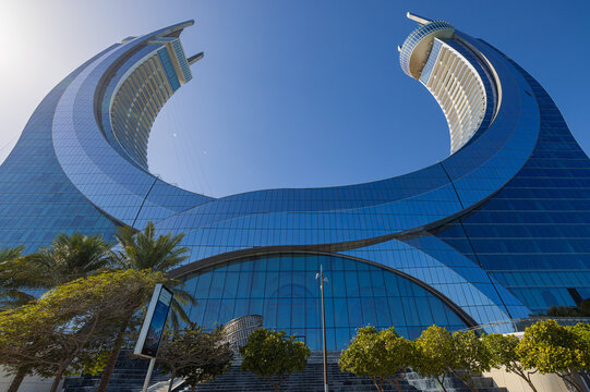 Doha, Qatar &ndash; January 3, 2026: The Katara Towers rise along the waterfront in Lusail, north of central Doha. The twin crescent-shaped skyscrapers, designed to reflect the crossed scimitars symbol from
