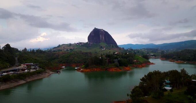 Famous landmark of La Piedra or The Rock of Guatap&eacute; inselberg on lakeshore