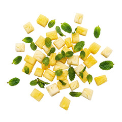 Chopped pineapple chunks with fresh mint leaves scattered around