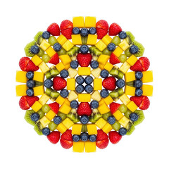 Fruit mandala with strawberries blueberries mango kiwi pineapple grapes