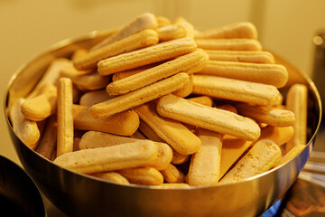 Heap of Ladyfinger Biscuits in a Metal Serving Bowl