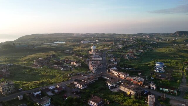 Aerial view of the landscape with a white dome structure nestled among lush green hills and small lake, Shillong, Meghalaya, India.