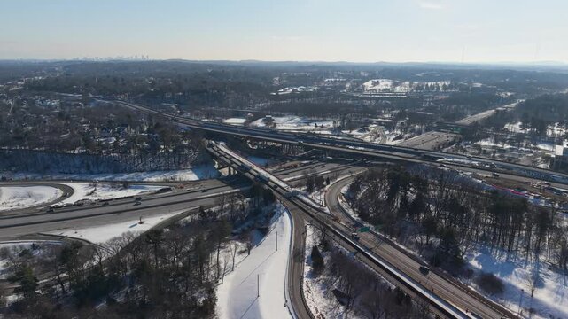 Aerial view of the Interstate 95 interchange showing snow covered ground and sparse trees, Salisbury, Massachusetts, United States.