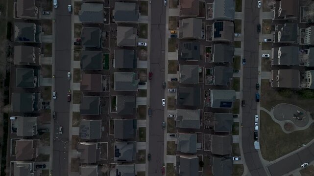 Aerial view of rooftops in a neighborhood showcasing a symmetrical layout and orderly arrangement of houses and streets, Broomfield, Colorado, United States.