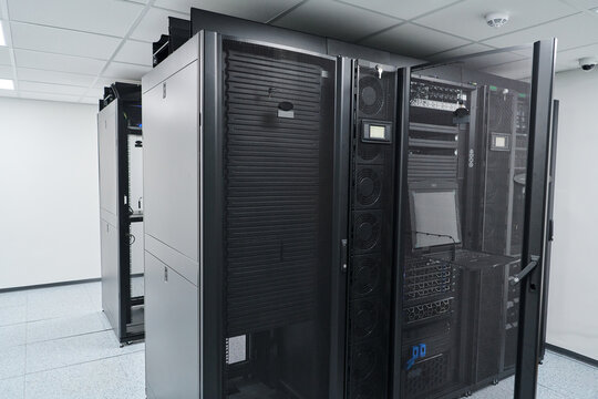 Modern data center server racks and network equipment in a secure, climate-controlled server room