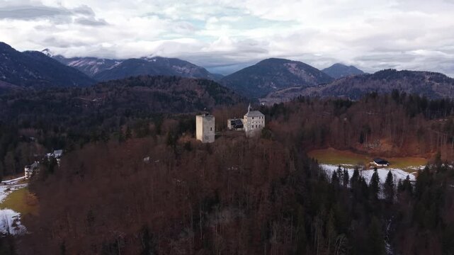 Bird eye view of Ruine Thierberg and chapel overlooking Kufstein, Austria. Historic medieval fortress with panoramic winter views of Inn River and Kaiser Mountains. Luftaufnahme Tirol, Oesterreich
