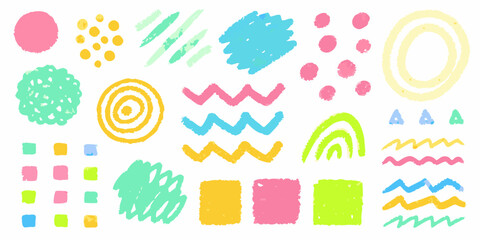 Colorful crayon scribbles and shapes arranged on a white background