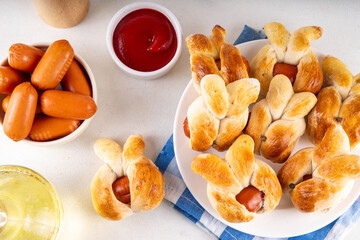 Easter Bunny Sausage Bread Rolls, Tasty Hot Dog buns in for of bunny faces, creative made food for Easter holiday party or brunch
