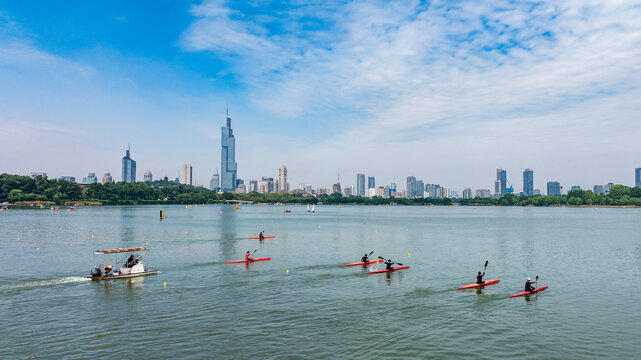 Kayaks on Xuanwu Lake in Nanjing, with the Zifeng Tower in the background.