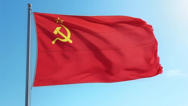 soviet flag with hammer and sickle on flagpole against blue sky