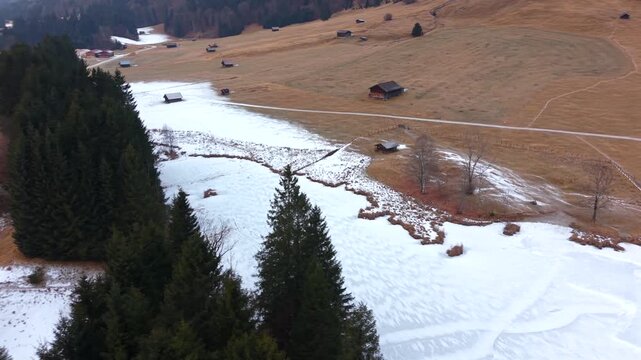 Winter beauty of Wagenbruchsee Geroldsee from the air. Located in Kruen Bavaria. This snowy alpine lake is one of the most popular destinations for hikers and tourists.