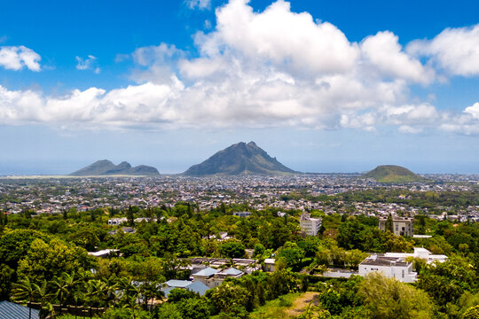 The viewpoint at Trou aux Cerfs, an extinct volcano in Mauritius, offers 360-degree panoramic views of the town of Curepipe, the surrounding residential areas, and the green mountain landscapes
