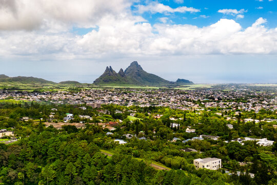 The viewpoint at Trou aux Cerfs, an extinct volcano in Mauritius, offers 360-degree panoramic views of the town of Curepipe, the surrounding residential areas, and the green mountain landscapes