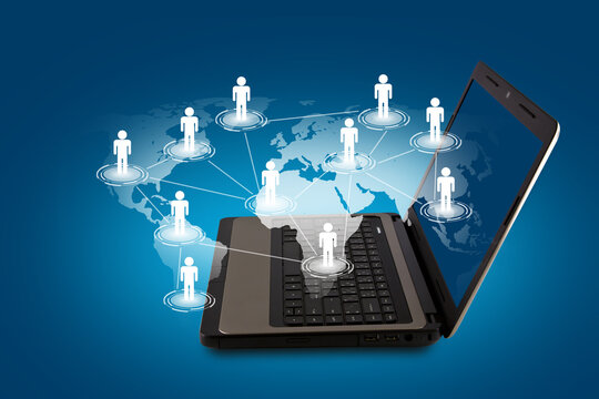Laptop displaying a global map with interconnected human illustrating online networking and worldwide digital connections through technology