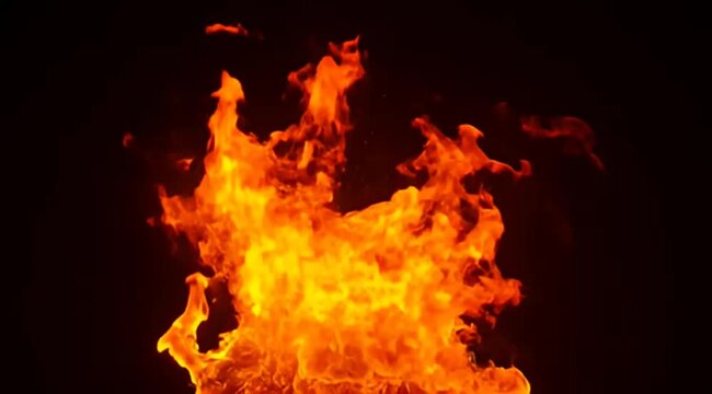 Intense flames erupting against a black backdrop, showcasing heat and energy