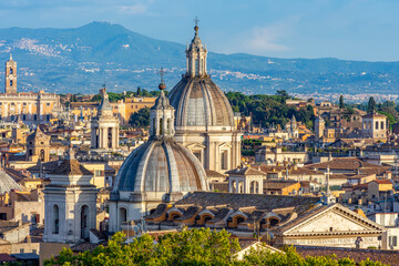 Obraz premium Scenic sunset cityscape of Rome center seen from top of St. Angel's castle, Italy