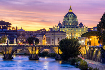 St. Peter's basilica dome in Vatican and St. Angel bridge over Tiber river at sunset in Rome, Italy © Mistervlad