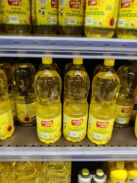 Saujon, France - January 24, 2026: Intermarche. Bottles of Boutron d'Or sunflower oil arranged on supermarket shelf, bright yellow labels and transparent packaging visible