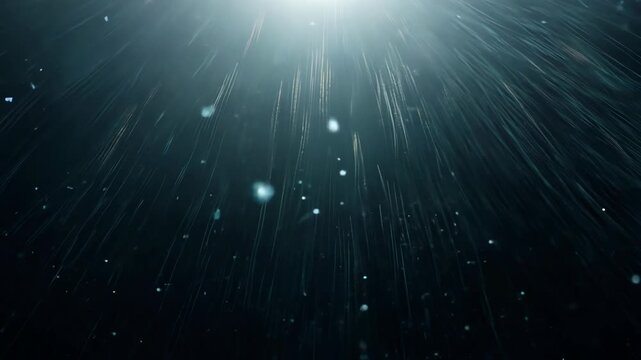 Light rays penetrate dark water, creating a mesmerizing underwater scene with particles floating and shimmering in the illuminated depths of the ocean