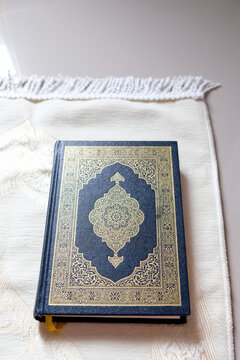 Holy Quran on a prayer mat, capturing a serene and peaceful atmosphere for Islamic worship