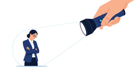 Large hand holding a flashlight to shine a beam of light on a sad businesswoman standing in the dark with crossed arms and a frown.