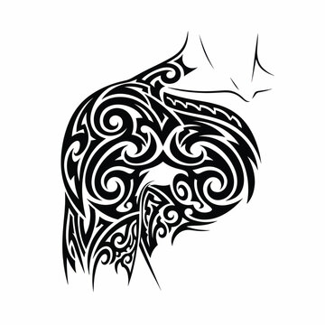 Black tribal shoulder and chest tattoo with swirling ornamental patterns.