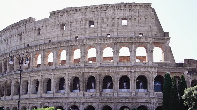 Beautiful exterior view of the historic Roman Colosseum amphitheater and the surrounding cityscape of Rome