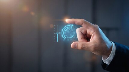 Obraz premium A businessman’s hand adjusting a virtual volume control dial interface.