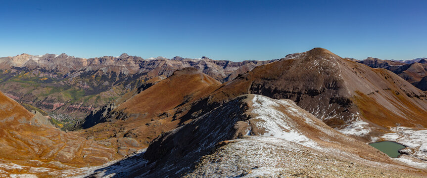 This scenic San Juan Mountain panorama features Colorado 13er La Junta Peak with the beautiful town of Telluride visible below.