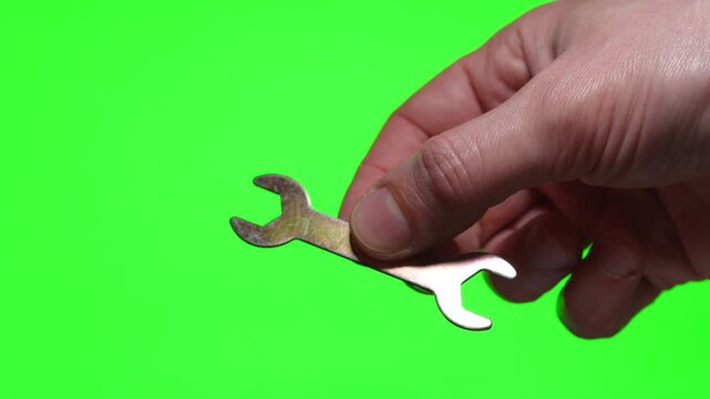 Close-up of a wrench on an insulated flange