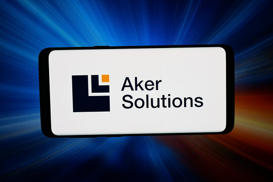 Stuttgart, Germany - 02-27-2026: In this photo illustration, the logo of engineering company Aker Solutions ASA is displayed on a smartphone in front of abstract background on computer screen.