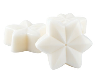Three ivory-colored, star-shaped wax melts, arranged closely on a transparent background