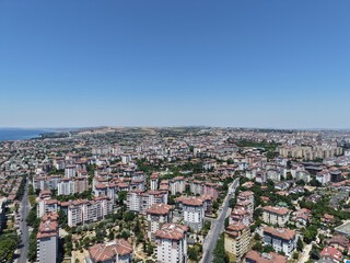 Obraz premium Aerial Panoramic View of Coastal Residential Neighborhood and Blue Sea Horizon